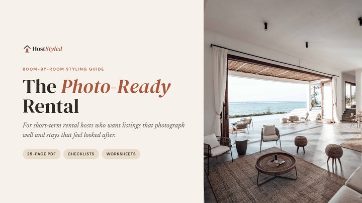 Cover of The Photo-Ready Rental styling guide, with a bright open-plan rental living room looking out to the sea